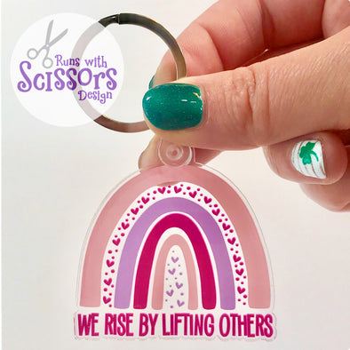 We Rise By Lifting Others Keychain